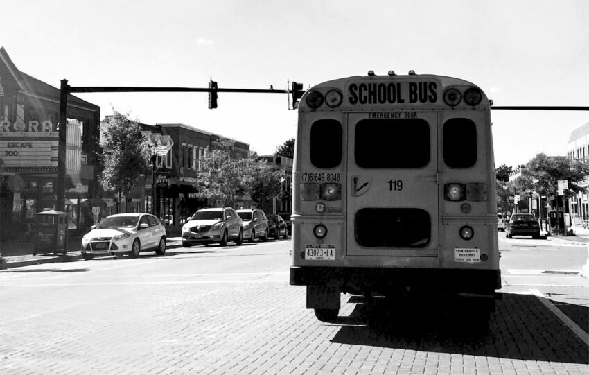 yellow school bus on road during daytime