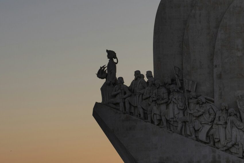 A large monument with a clock on top of it