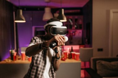 Young adult playing virtual reality games with headset and controller in a stylish indoor setting.