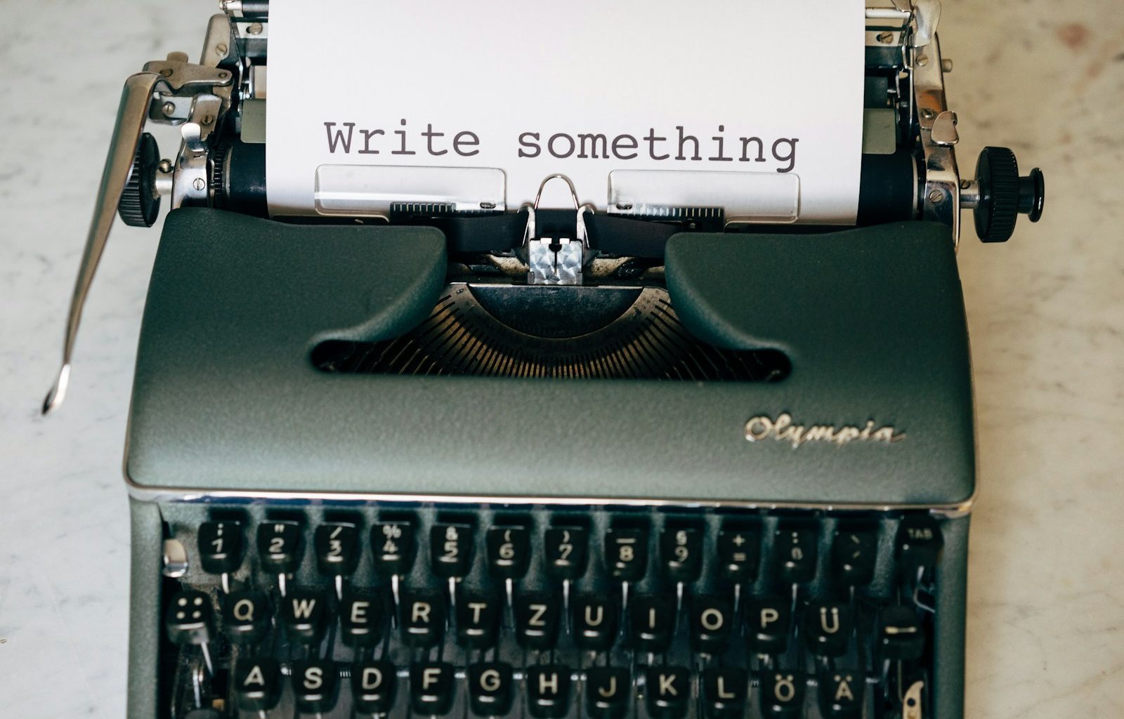 black and white typewriter on green table