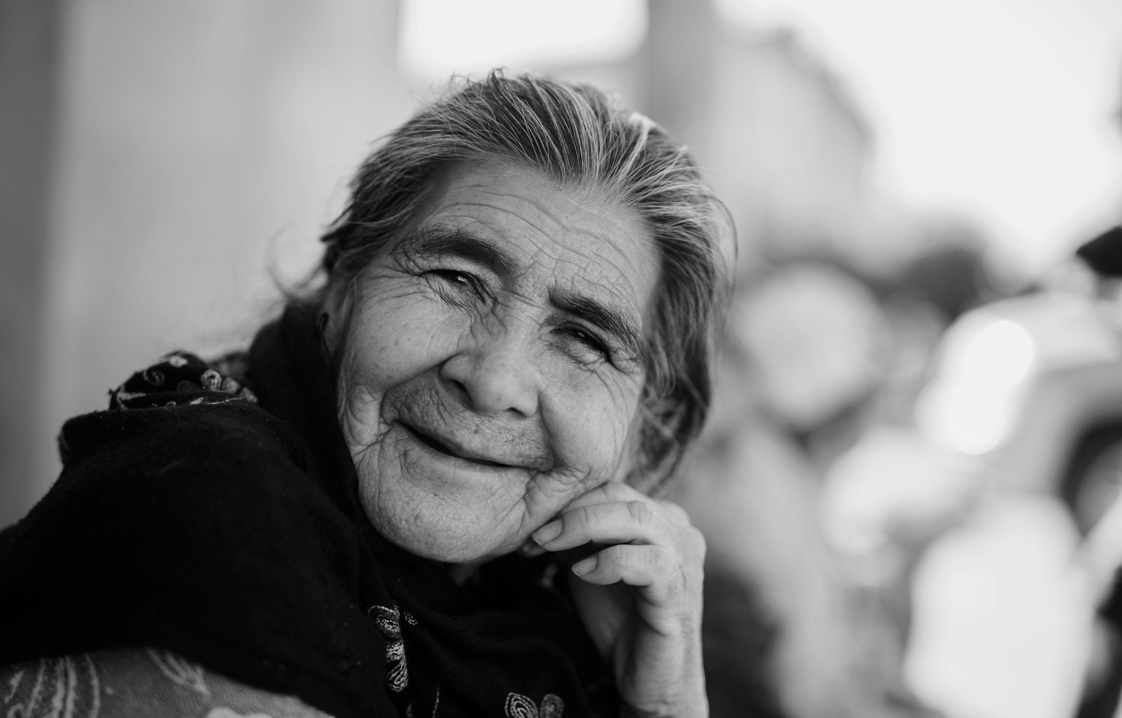 grayscale photo of woman smiling